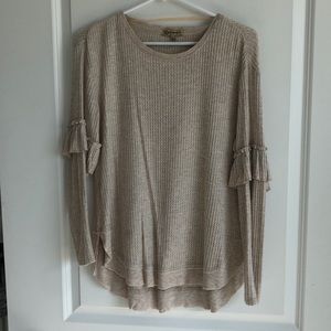 Long sleeved Henley with ruffle detail